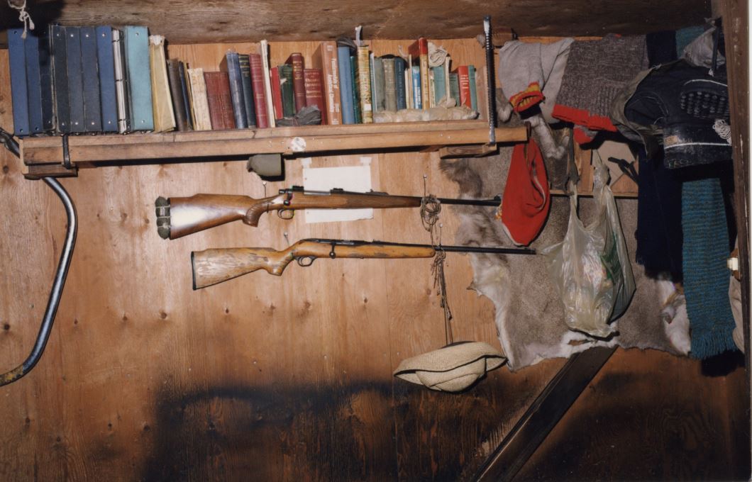 Inside Kaczynski’s small cabin including books, hunting rifles and other items