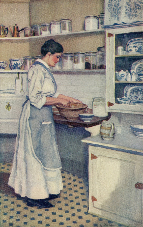 A woman in a long dress and apron mixing something in a bowl that rests on a kitchen shelf