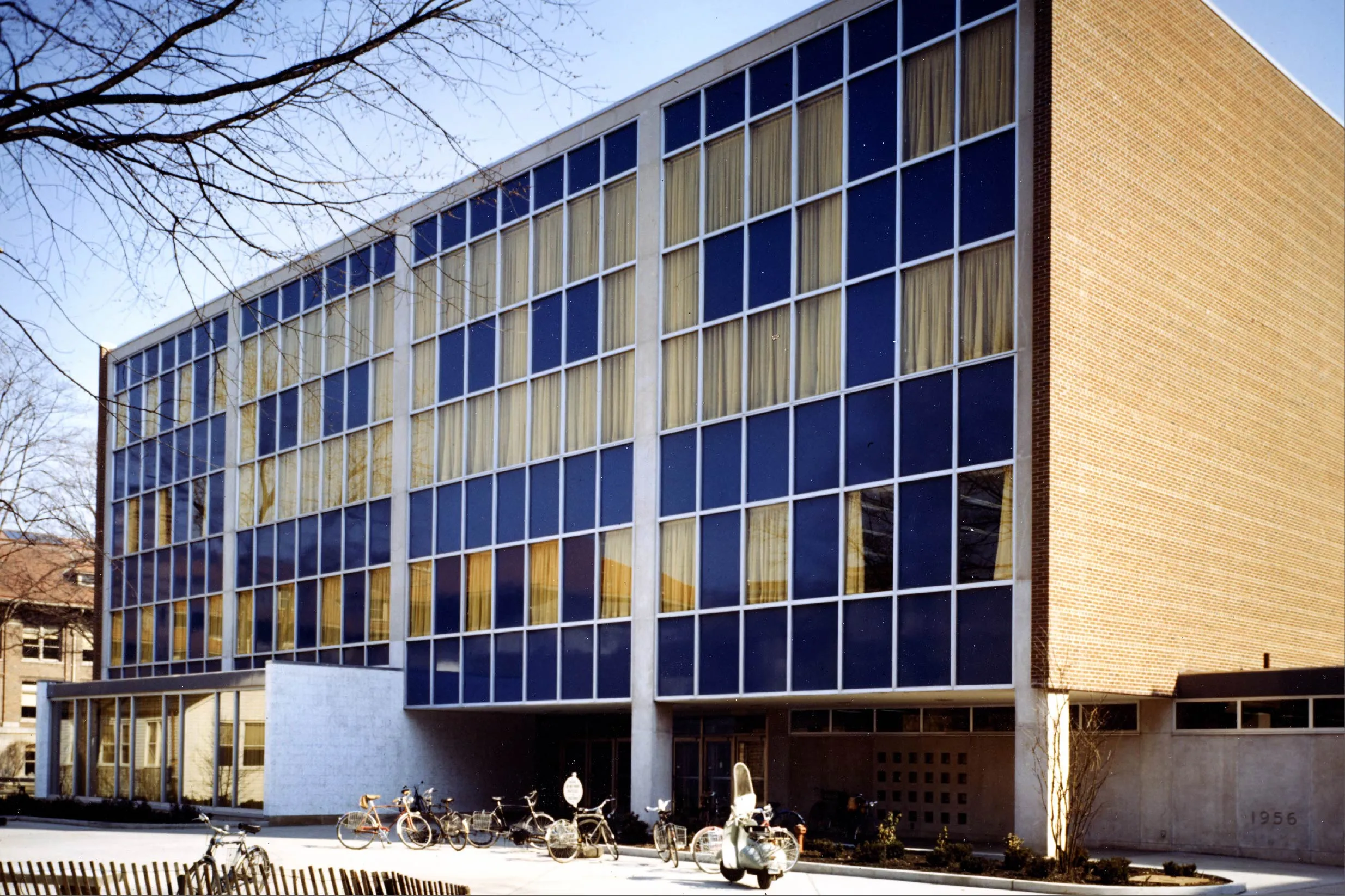 a large building with a wall of windows