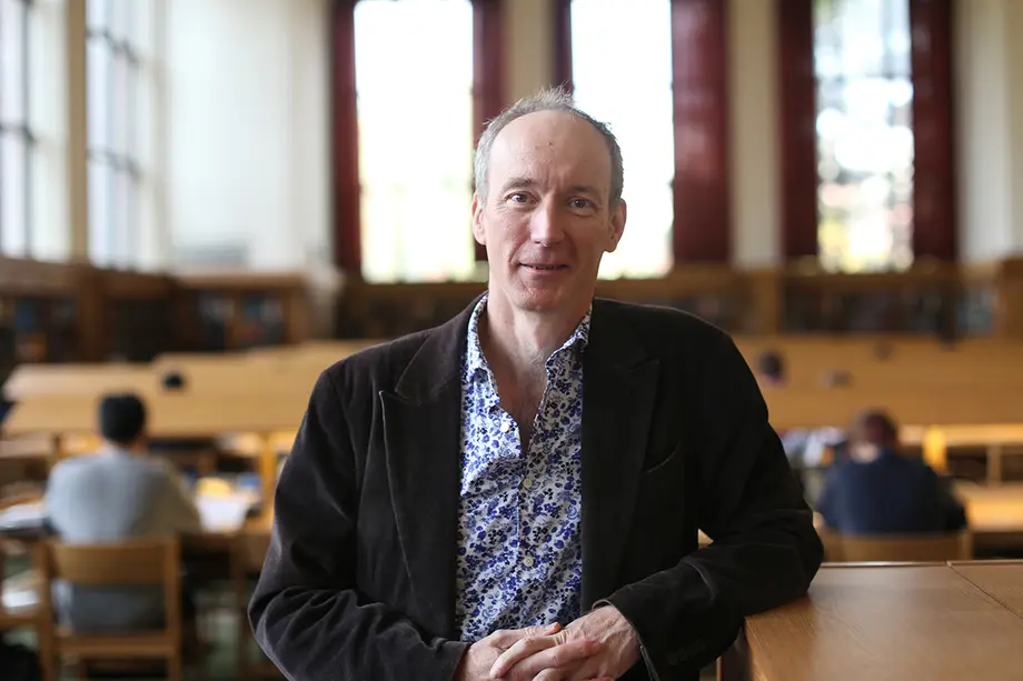 Nick Wilding stands in the library's Reference Reading Room.