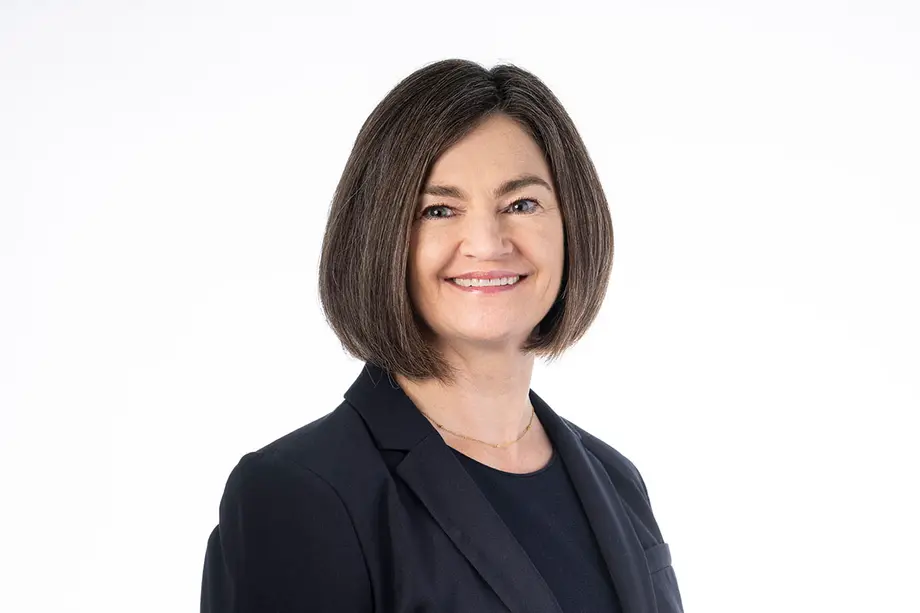 Lisa Carter, wearing a black blazer.