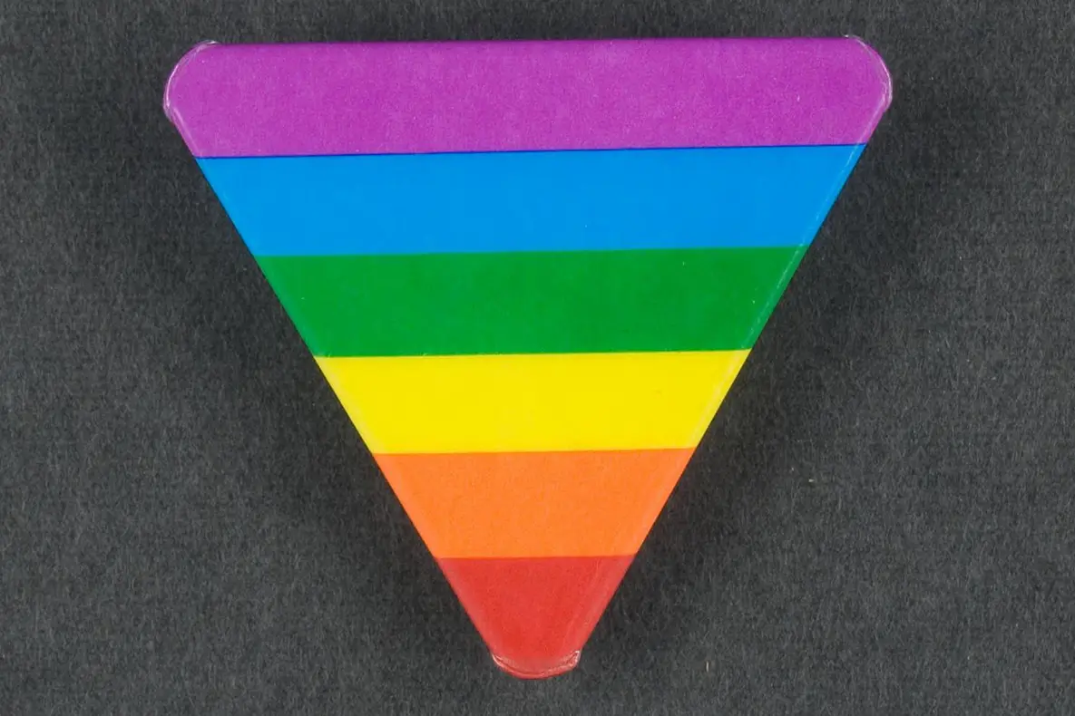 Triangle with rainbow stripes.