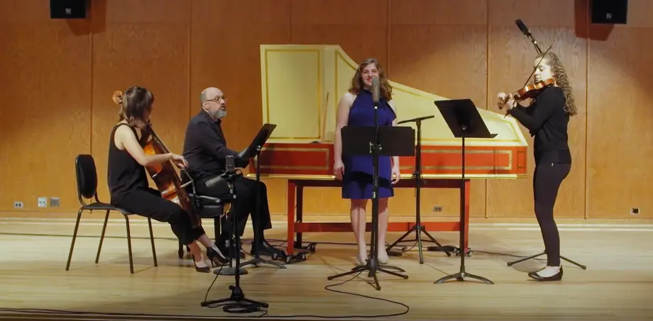 four musicians: cello, harpsichord, violin, vocals