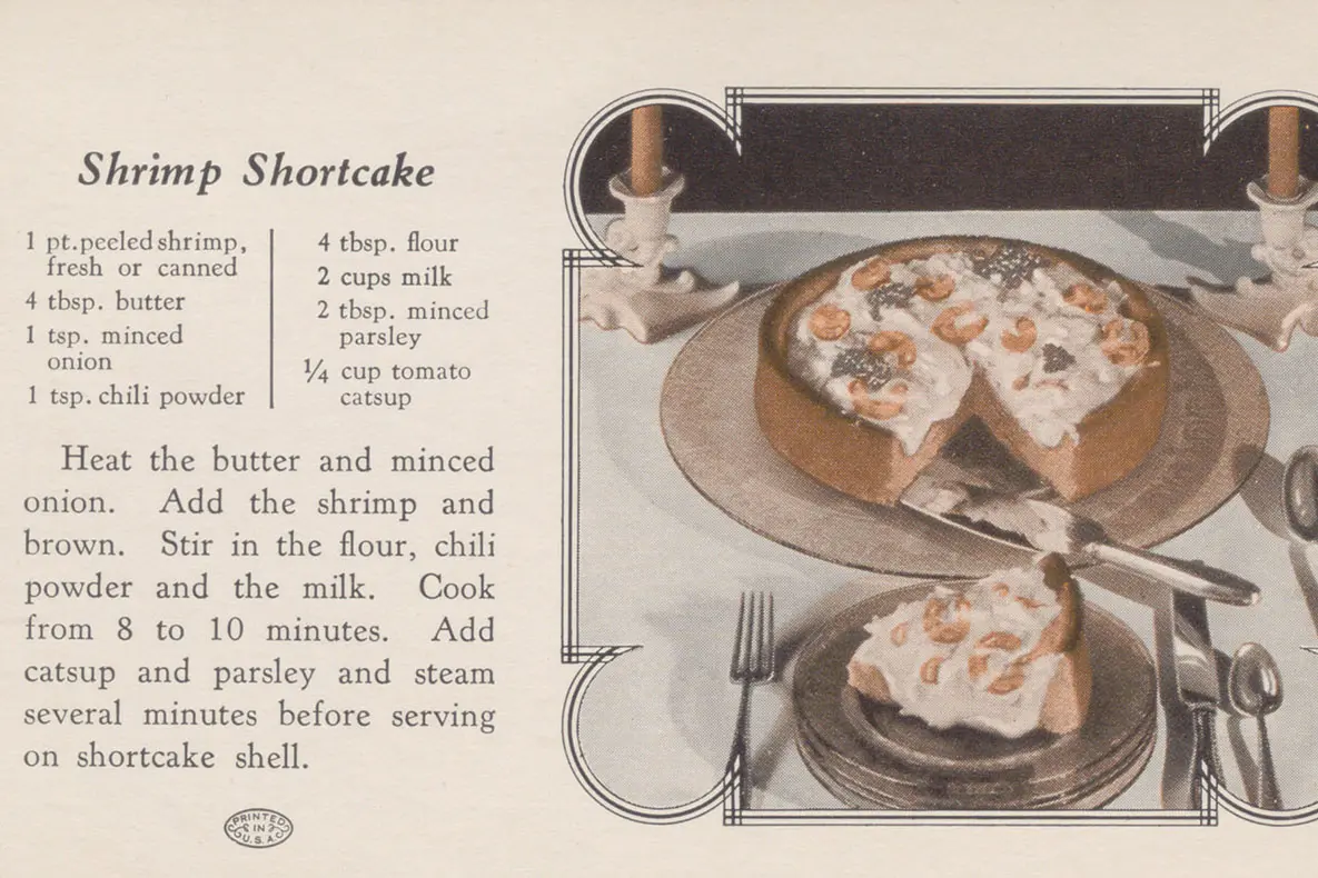 Recipe card with a recipe for shrimp cooked in cream sauce and served on a shortcake shell, like the ones sold today for strawberry shortcake. 