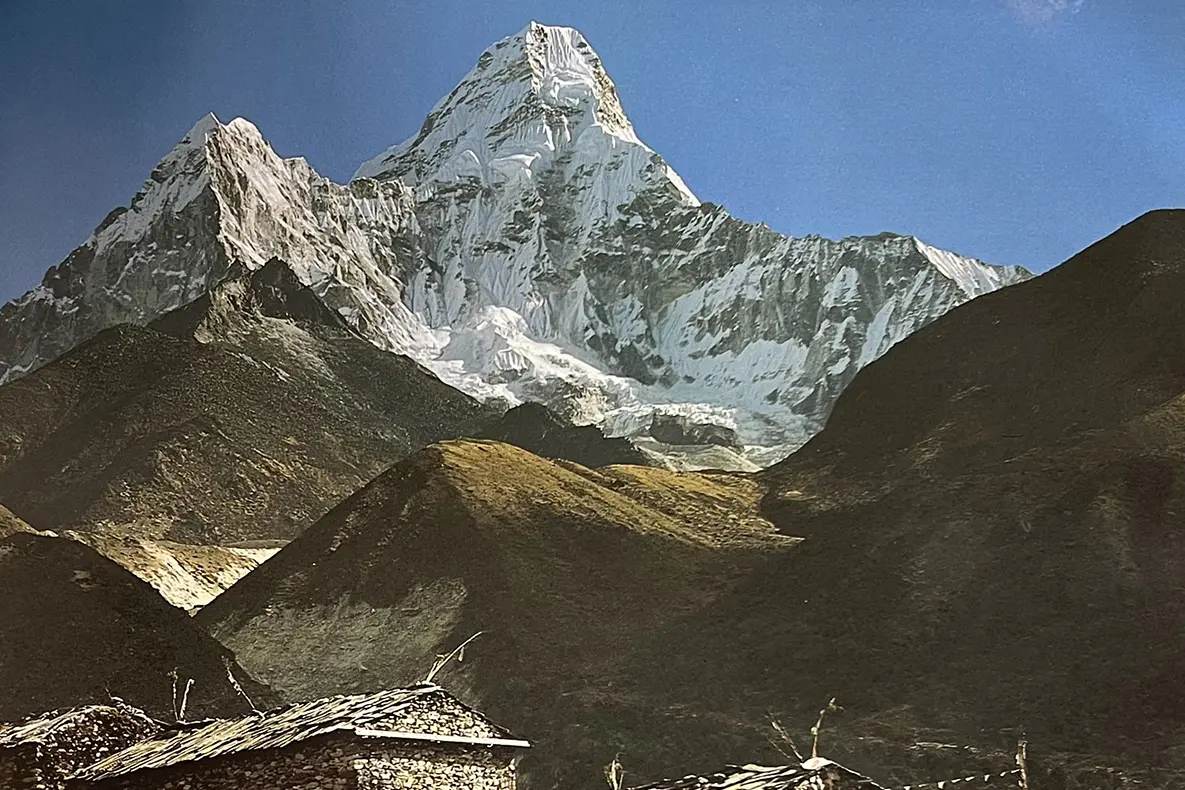 Mountain peaks, the largest ones covered in snow.