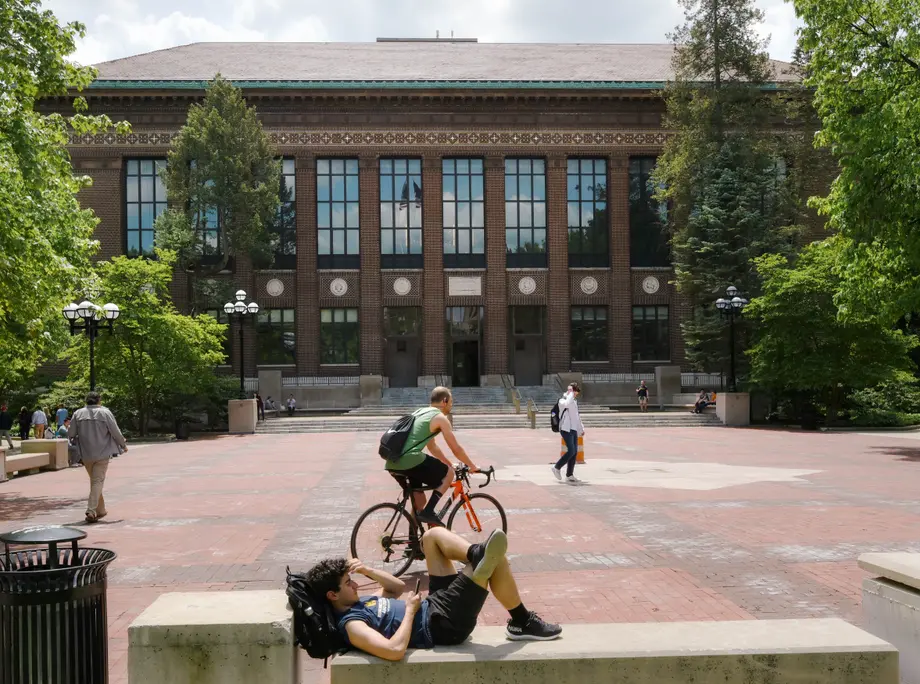 exterior of hatcher north entrance with people on the diag