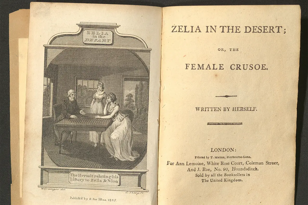 An open book with a illustration on the left and title page for Zelia in the Desert on the right.