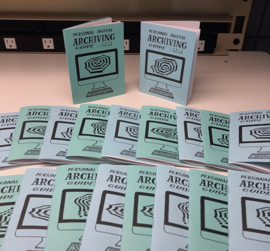 Multiple copies of the Personal Digital Archiving Zine on display.