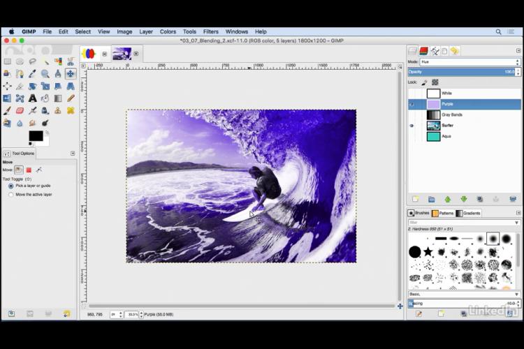 Screenshot of the lesson tutorial for using layer blending. A normal colored image of a surfer has been recreated to purple tones using a purple layer above the image and some special effects.