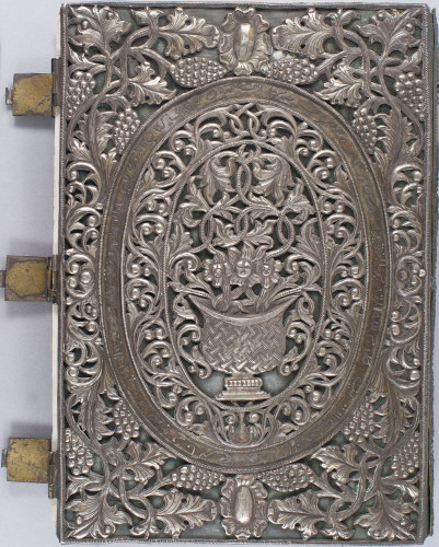 metal cover with floral motif