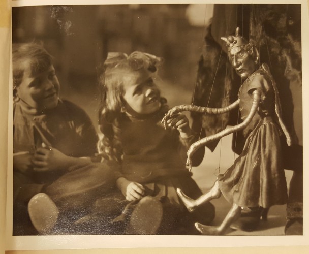 Children watching a marionette