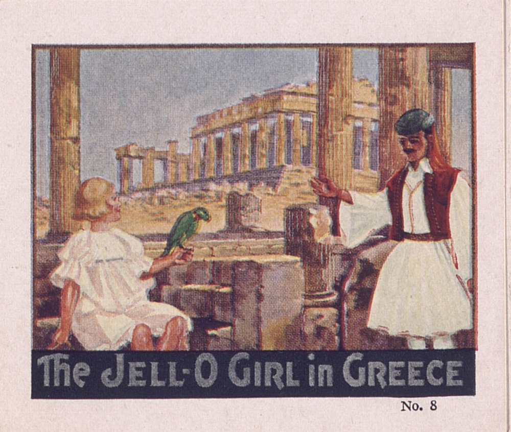 A yound blonde Jell-o Girl, in a white frock and with a parrot on her hand, listens to a man in traditional Greek costume. The Parthenon is shown in the background.
