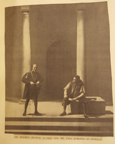 Photograph in news clipping of Iago and Othello on stage