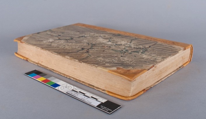 shows the fore-edge of volume two, with the corners of the boards repaired