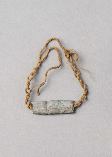Amulet on a Bracelet. Karanis, Egypt; 3rd-4th c.AD. Lead, string; 220 x 80 mm. KM 24255. University of Michigan Excavations, 1928