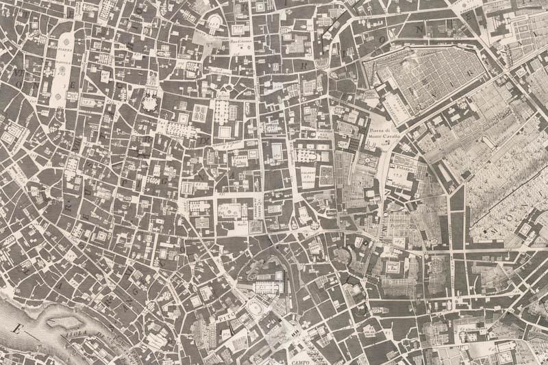 Handrawn, grayscale, aerial map of streets and buildings.