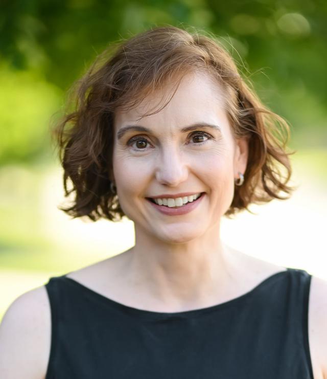 Melissa Stewart, a white woman with short brown hair wearing a black shirt.