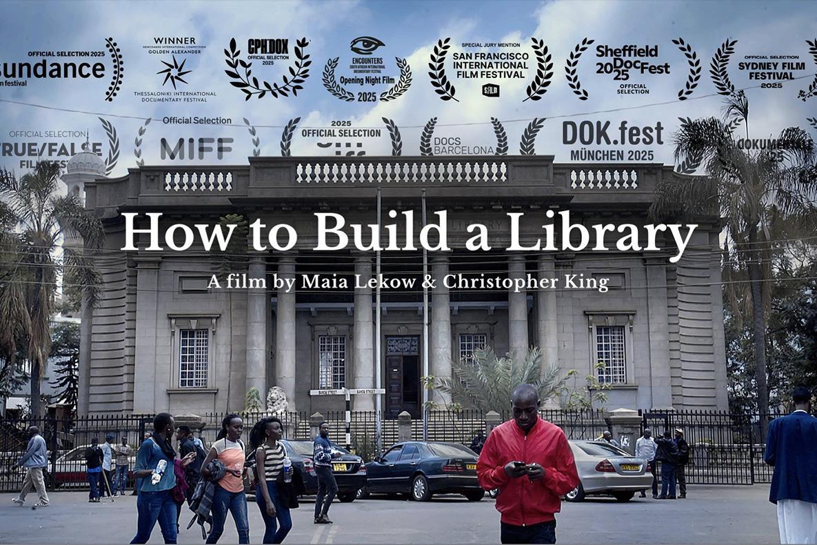 The front of a stately library, fronted by columns.