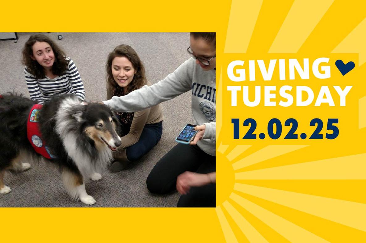 Students petting a dog, Giving Tuesday, 12-02-25.