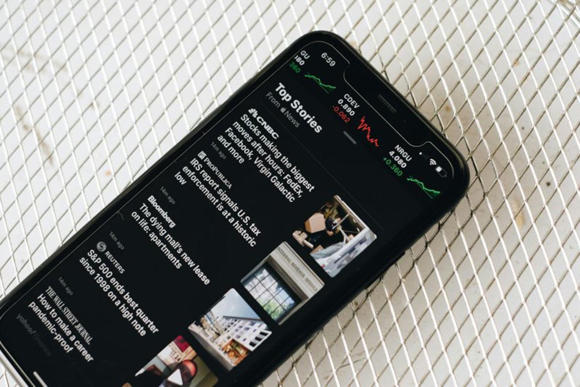 A smartphone displaying news headlines.