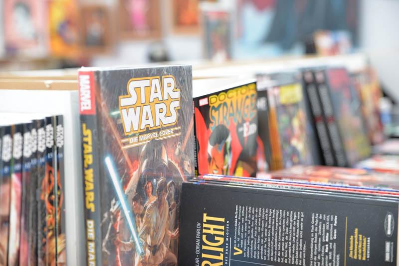 Photo of various comic books, including Star Wars and Doctor Strange.