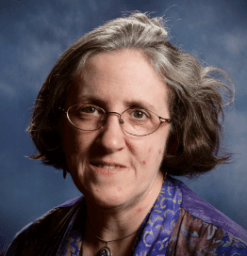 PF Anderson's Photo, an older white woman with gray and brown hair wearing glasses