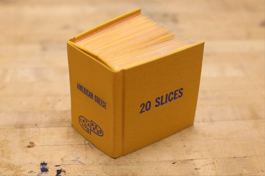 Cheese book standing upright on a wood table