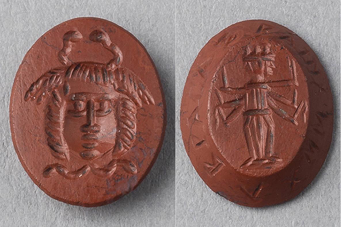 Two sides of an oval amulet: Frontal gorgon head with serpents extending from the scalp and neck, and a triple-bodied Hekate wielding weapons, encircled with magical formulas or names. 
