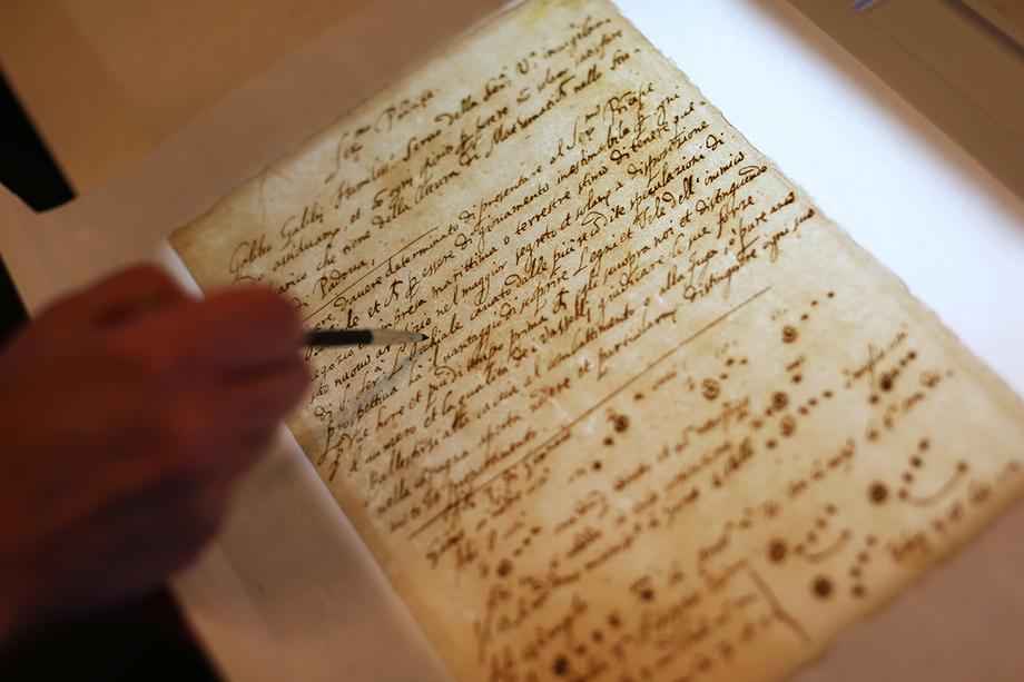 Pointing at the watermark on the Galileo manuscript.