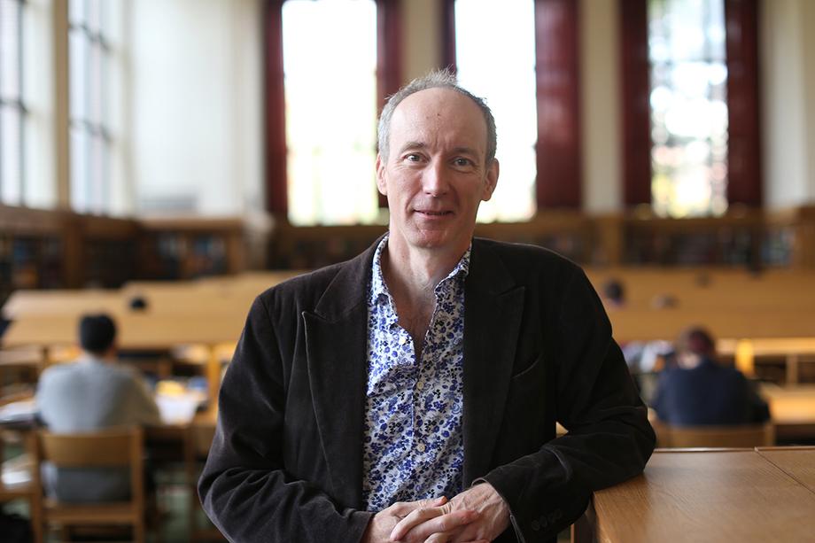 Nick Wilding stands in the library's Reference Reading Room.