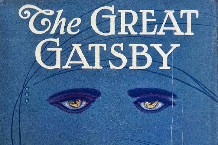 The words The Great Gatsby above a woman's eyes, on a blue background