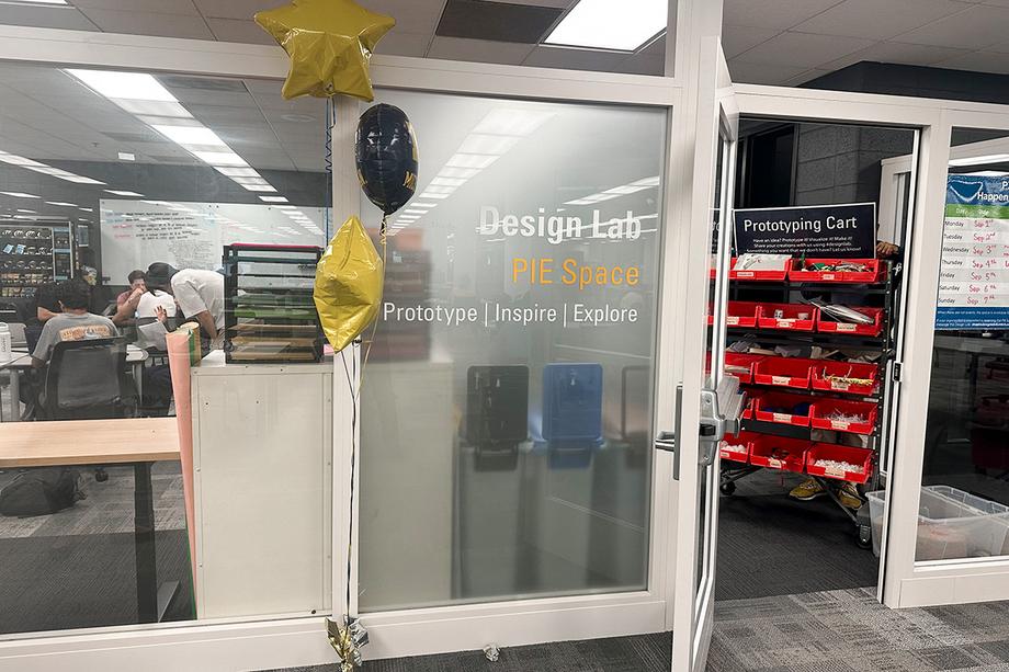Entrance to the PIE Space with a prototyping cart full of materials in view.