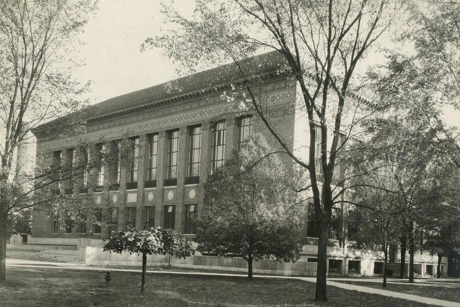 a large building with tall windows on the upper floor