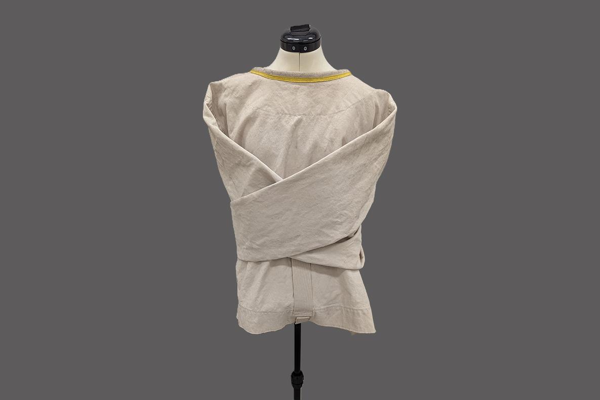 Silence of the Lambs straight jacket costume displayed on a mannequin.